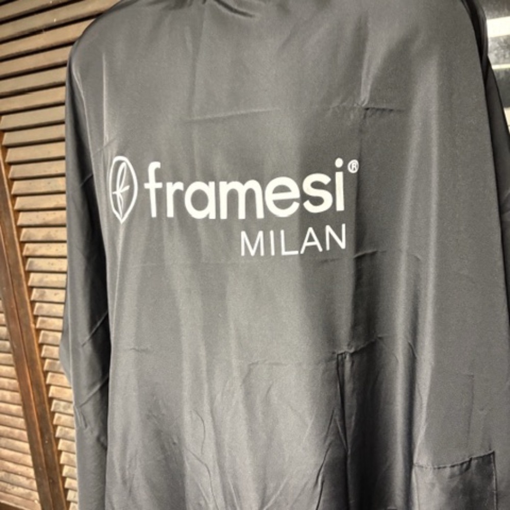 Framesi Nylon Hair Cutting Cape - snap adjustable, hand access slots in front.